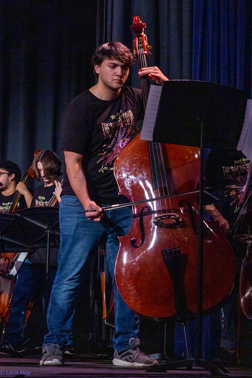 Orchestra students perform onstage